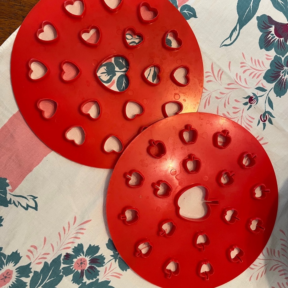 Red plastic pie cutters, heart and apple